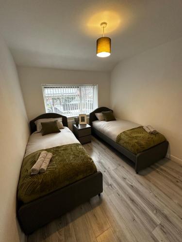 En eller flere senge i et værelse på Blackthorne House