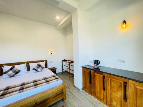 Ένα ή περισσότερα κρεβάτια σε δωμάτιο στο Crossing Royal