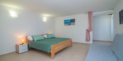 En eller flere senge i et værelse på Marija