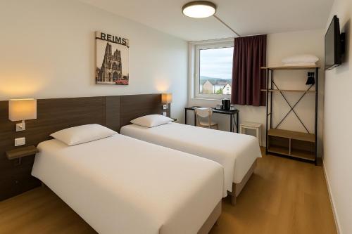 Postel nebo postele na pokoji v ubytování Als Hôtel