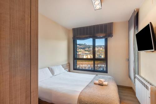 Postel nebo postele na pokoji v ubytování Niu Turistic Olvan