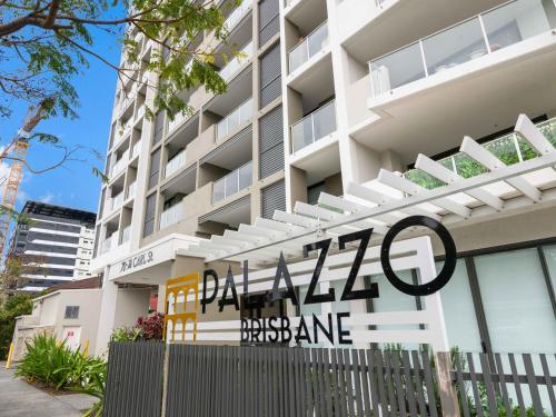 a building with a sign in front of it at Timi Property in Brisbane