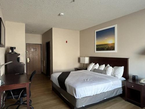 Ένα ή περισσότερα κρεβάτια σε δωμάτιο στο McPherson Inn