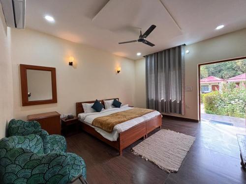 Ένα ή περισσότερα κρεβάτια σε δωμάτιο στο The jungle retreat ranthambore