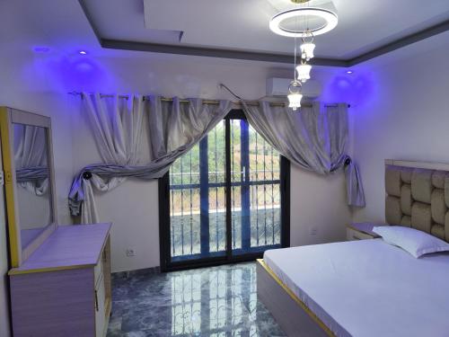 Ένα ή περισσότερα κρεβάτια σε δωμάτιο στο Résidence marie