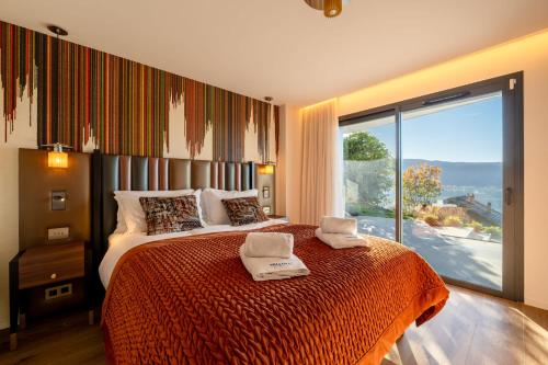 En eller flere senge i et værelse på Villa Rita - vue Lac