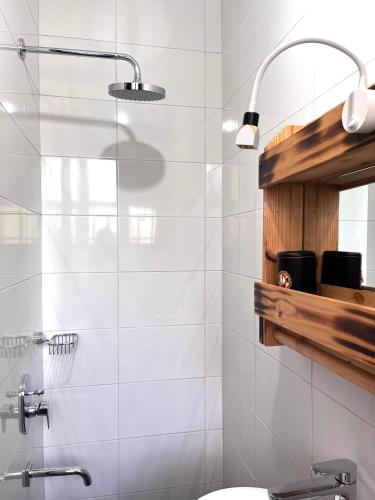 a bathroom with a shower and a sink at Marini Ndoto in Themi
