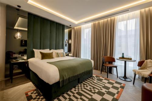 Ένα ή περισσότερα κρεβάτια σε δωμάτιο στο The Hobson Cambridge by Adina