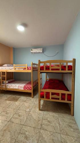 a room with two bunk beds in a room at Casa con Piscina Privada in Salinas