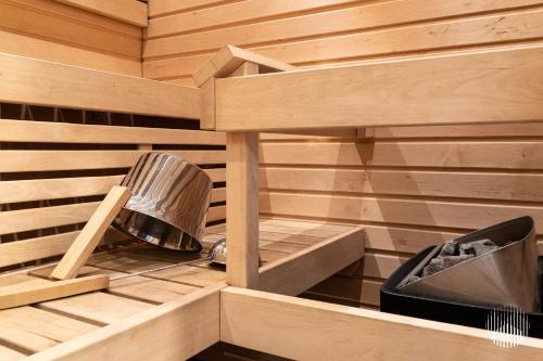 a wooden sauna with a fan and a pot at Sivulantie 4 109 by Holiday in Lapland in Äkäslompolo