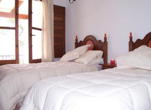 Postel nebo postele na pokoji v ubytování Casa del Medico