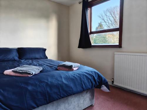 En eller flere senge i et værelse på Wilmslow House