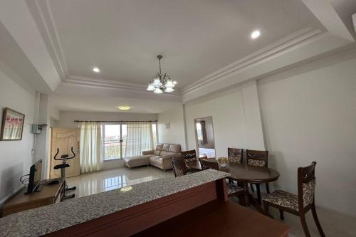 a living room with a couch and a table at U.D.Home Apartment in Ban Chang