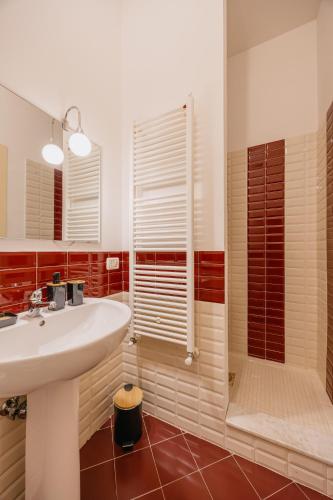 a bathroom with a sink and a shower at BHR - La Finestra su Spoleto in Spoleto