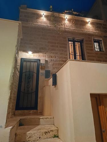 a building with a gate on the side of it at CASA ENRICA in Adelfia