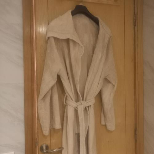 a robe is hanging on a door at Puerto Marina Dar Bouazza in Dar Bouazza