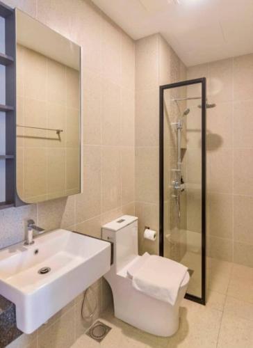 a bathroom with a sink and a toilet and a shower at Central Georgetown Studio with Nespresso Machine in George Town