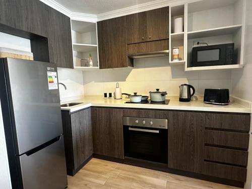 مطبخ أو مطبخ صغير في Hermoso Departamento a Pasos de la Playa - La Serena