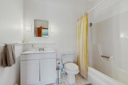 a white bathroom with a sink and a toilet at The Prospect House in Bethlehem