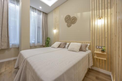 En eller flere senge i et værelse på Apartamentos Brisas de Cádiz 1