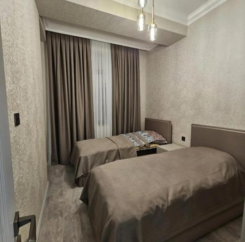 Postel nebo postele na pokoji v ubytování Ayta Prince Apartment