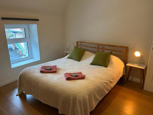 a bedroom with a bed with two towels on it at La Pistacherie à 30m de la plage de Grande Rive in Évian-les-Bains