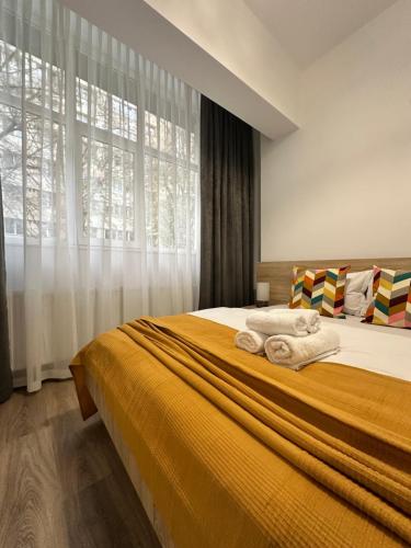 En eller flere senge i et værelse på 27 RENT Apartments