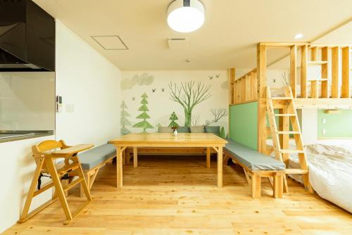 Postel nebo postele na pokoji v ubytování Goen Little hatchi 子供が喜ぶ隠れ家宿