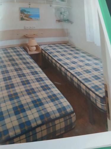 Ένα ή περισσότερα κρεβάτια σε δωμάτιο στο mobil home