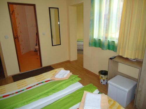 En eller flere senge i et værelse på Къща за гости Пиперите