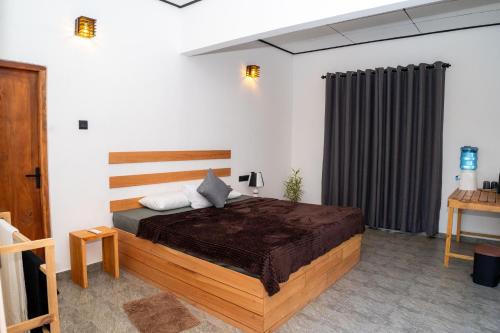 a bedroom with a large bed in a room at Ninety Four Plus Madiha in Matara