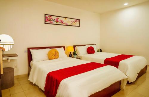 Postel nebo postele na pokoji v ubytování Khách sạn Trung Hiếu