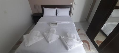 Postel nebo postele na pokoji v ubytování GF AXD Apartment