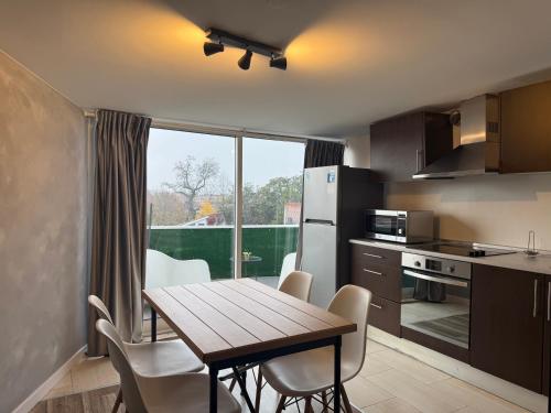 a kitchen and dining room with a table and chairs at Apartments Historic Center • Collection by Perpetual Relax in Braga
