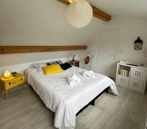 Ein Bett oder Betten in einem Zimmer der Unterkunft Carnets de Voyages Maison 4 à 6 personnes