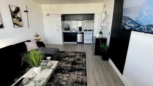 a living room with a couch and a table at Luxe Skyrise Condo Downtown Jax in Jacksonville