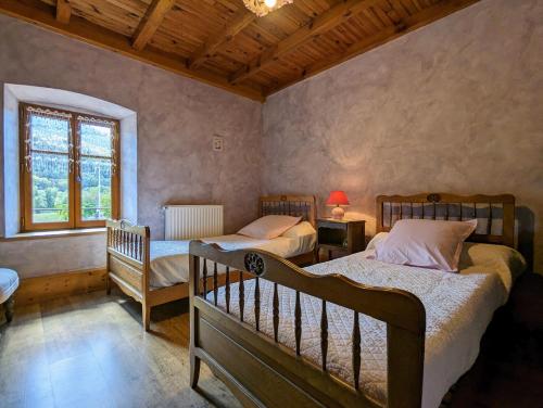 Ένα ή περισσότερα κρεβάτια σε δωμάτιο στο Chambre d'hôtes à Vousse