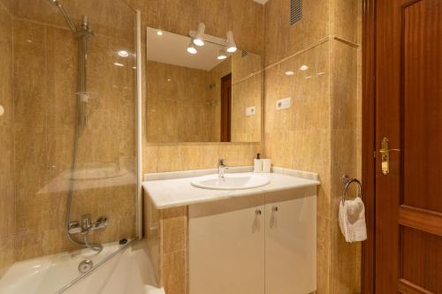 a bathroom with a sink and a shower at Apartamentos Miguel Angel in Estepona