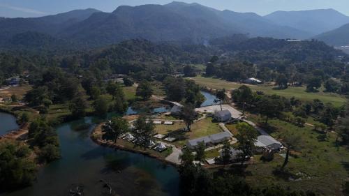an aerial view of a house next to a river at L'camp and cafe' Kohchang in Trat