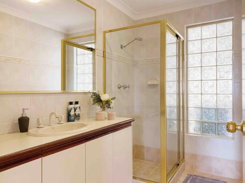 a bathroom with a sink and a shower at Pet friendly home near Adventure World Fiona Murdoch in Perth