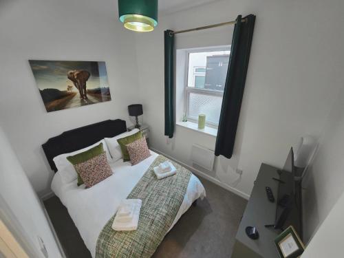 Postel nebo postele na pokoji v ubytování Calm 1-Bedroom Apartment