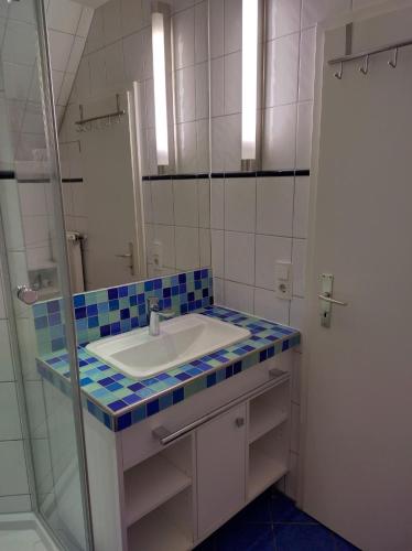 a bathroom with a sink and a mirror at Ferienwohnung Seeblick 222 in Koserow