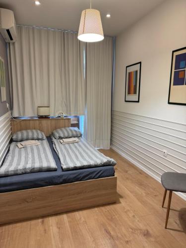 Ένα ή περισσότερα κρεβάτια σε δωμάτιο στο Happy Day