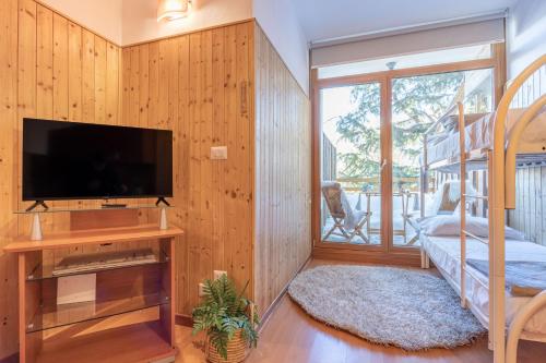 Et tv og/eller underholdning på Alpine Terrace Apartment - Grand Maison