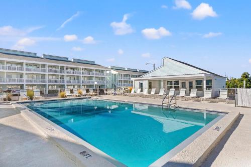 a large swimming pool in front of a hotel at Southwind by Panhandle Getaways in Panama City Beach