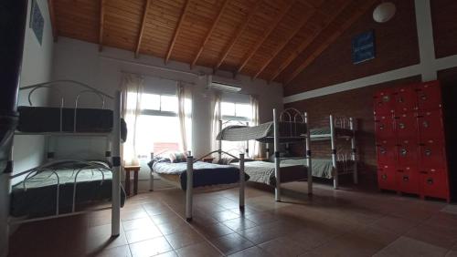 Postel nebo postele na pokoji v ubytování Hostel Bahía Ballenas