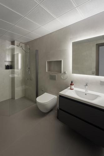 a bathroom with a toilet and a sink at Elegant Ephesus Suites - Hadrian in Selçuk