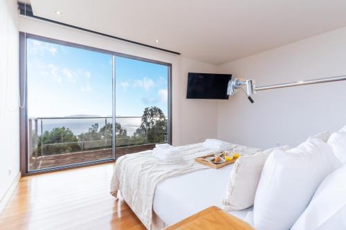 En eller flere senge i et værelse på Casa Vista Azul by Atlantic Holiday