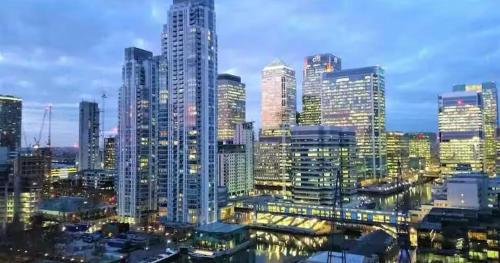 a city skyline with tall skyscrapers at East London Suites in London