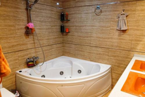 a bath tub in a bathroom with a shower at Villa close to the center w pool garden H30 in Begur